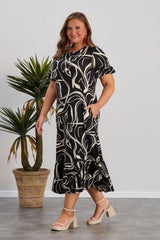 Plus - Size Patterned Dress With Ruffled Hem — Multicolor