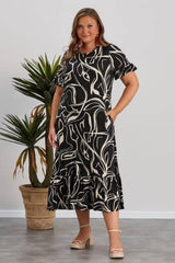 Plus - Size Patterned Dress With Ruffled Hem — Multicolor